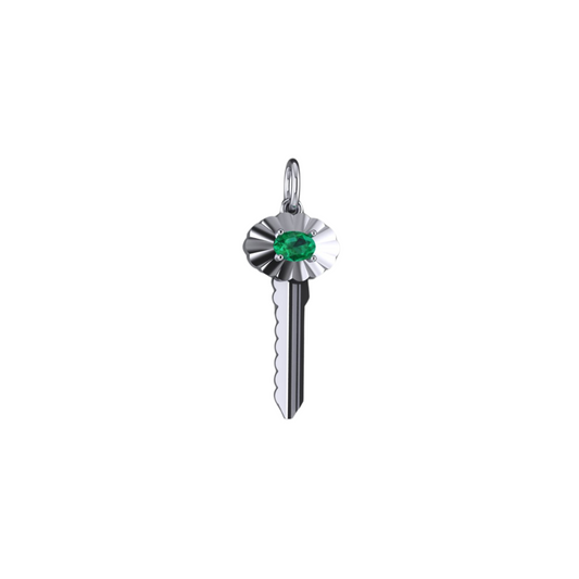 A white gold key-shaped pendant with a scalloped frame and a central oval-cut emerald.