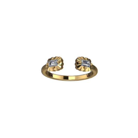 An 18K yellow gold diamond scalloped cuff ring with an emerald cut diamond set in an open cuff design, surrounded by scalloped detailing.