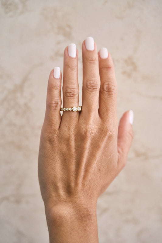 Graduated Bezel Round Eternity Band – Henri Noël