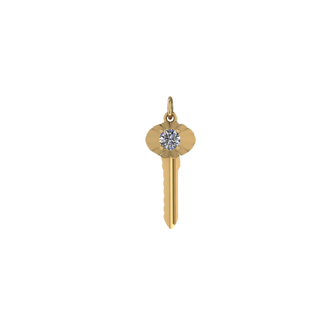 A gold key-shaped pendant with a round diamond embedded in the top center, set against a white background.