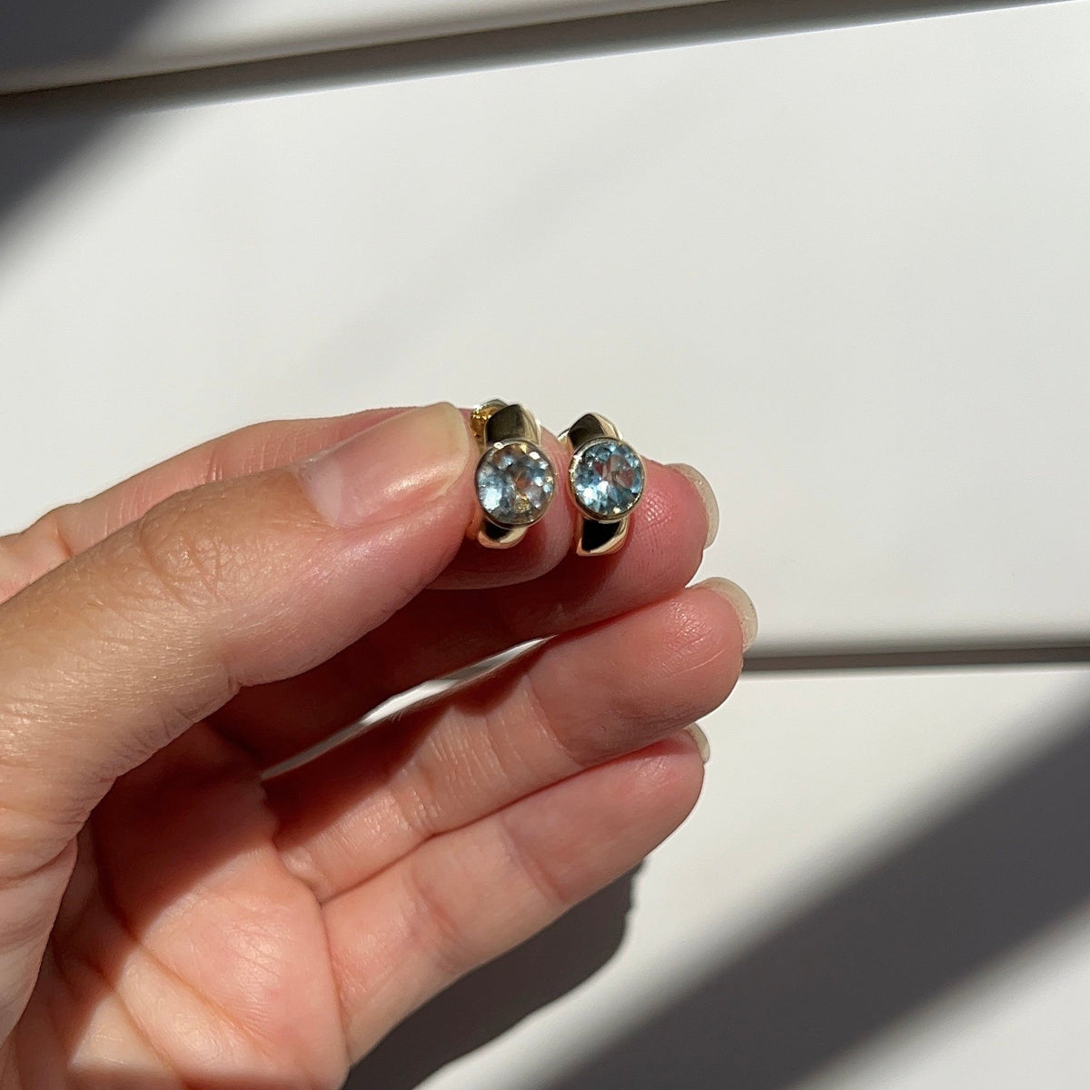 Bezel Blue Topaz Huggies – Henri Noël
