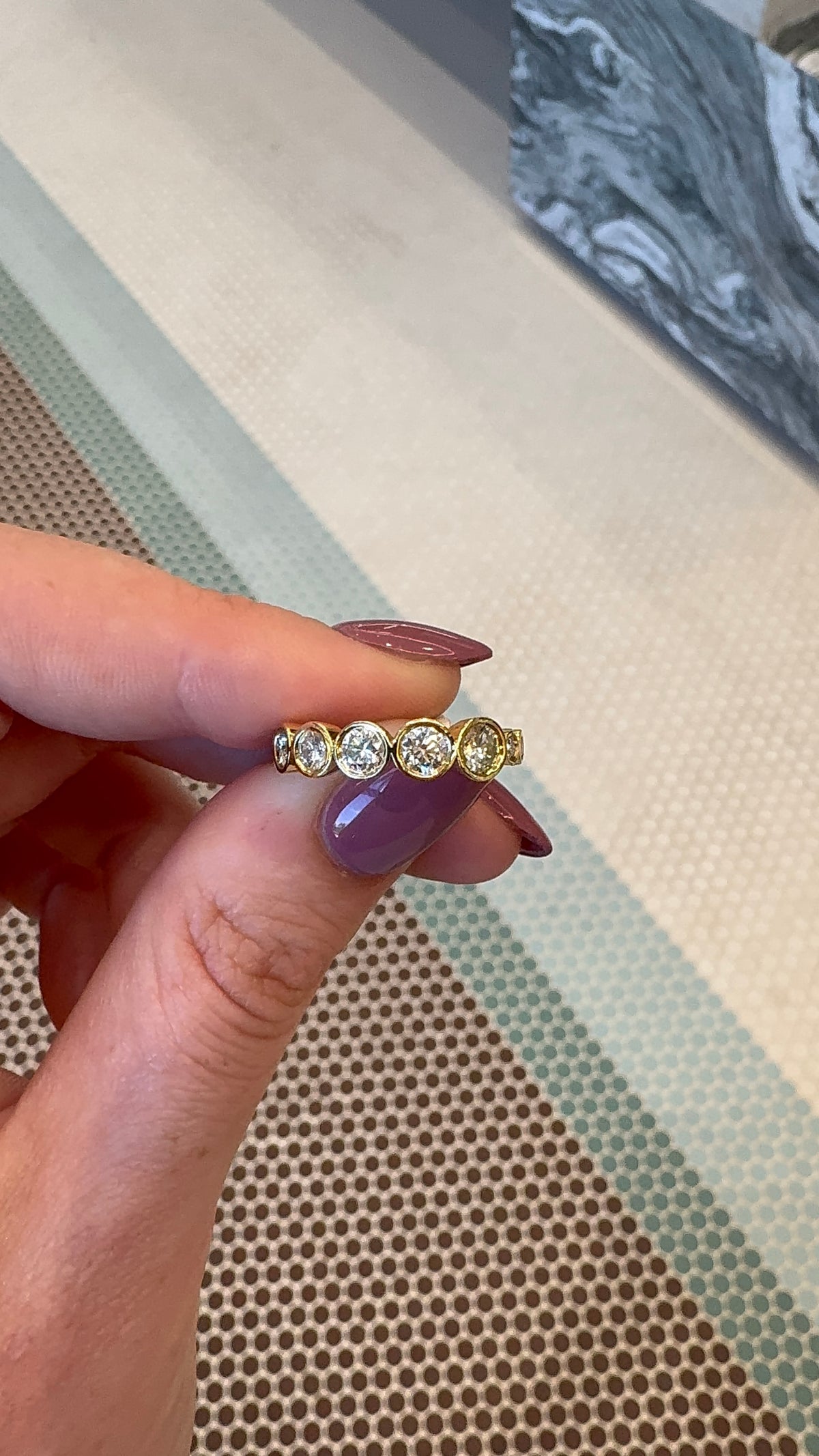 Graduated Bezel Round Eternity Band – Henri Noël