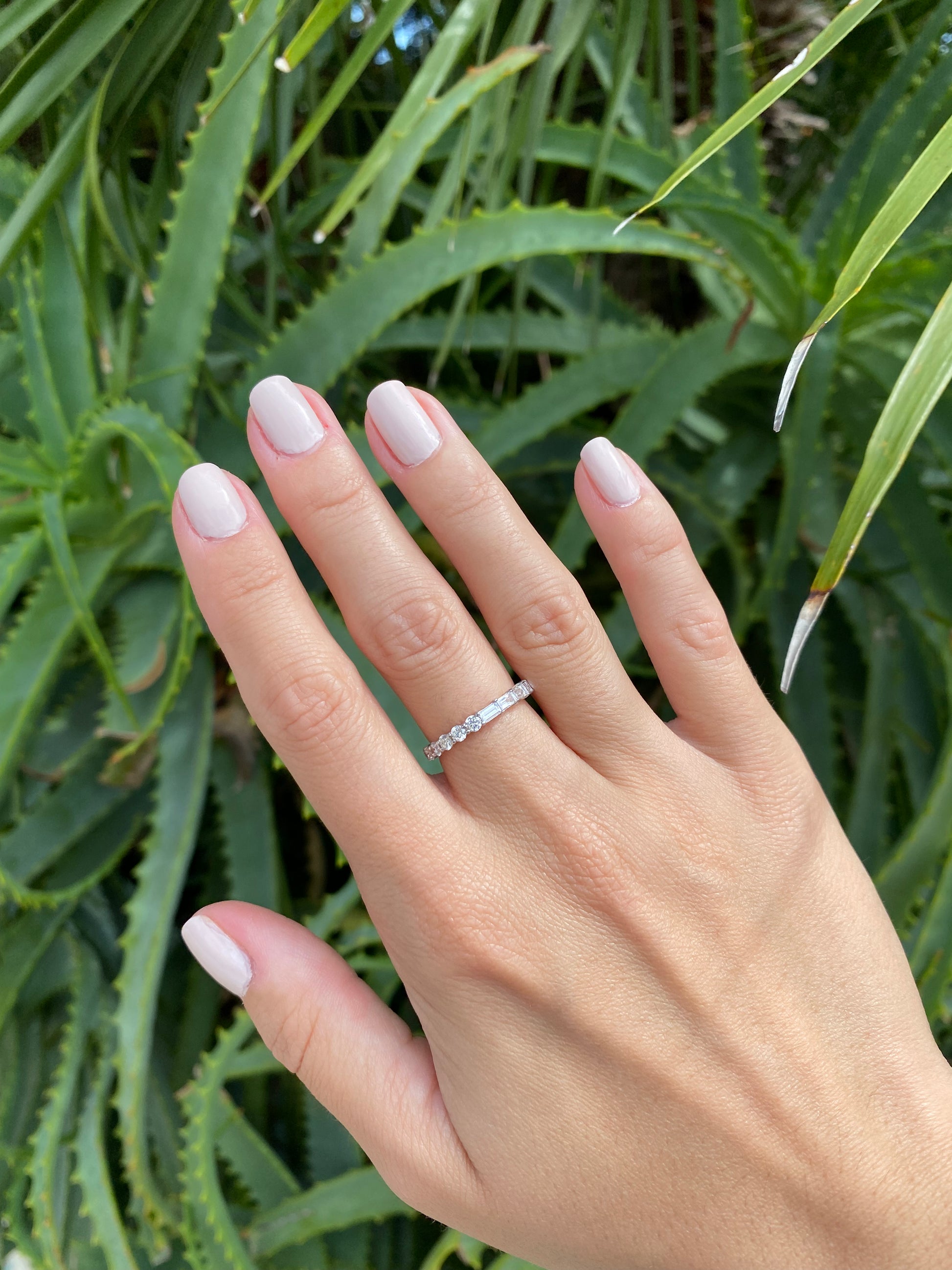 Half Round & Half Emerald Eternity Band – Henri Noël