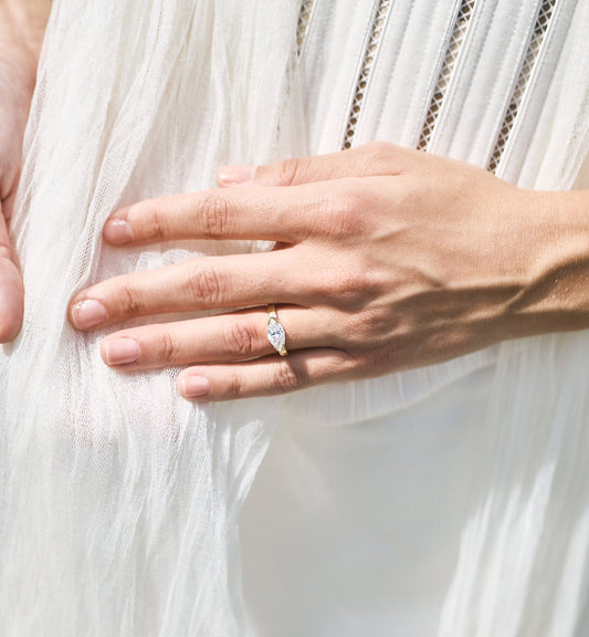 marquise half bezel engagement ring