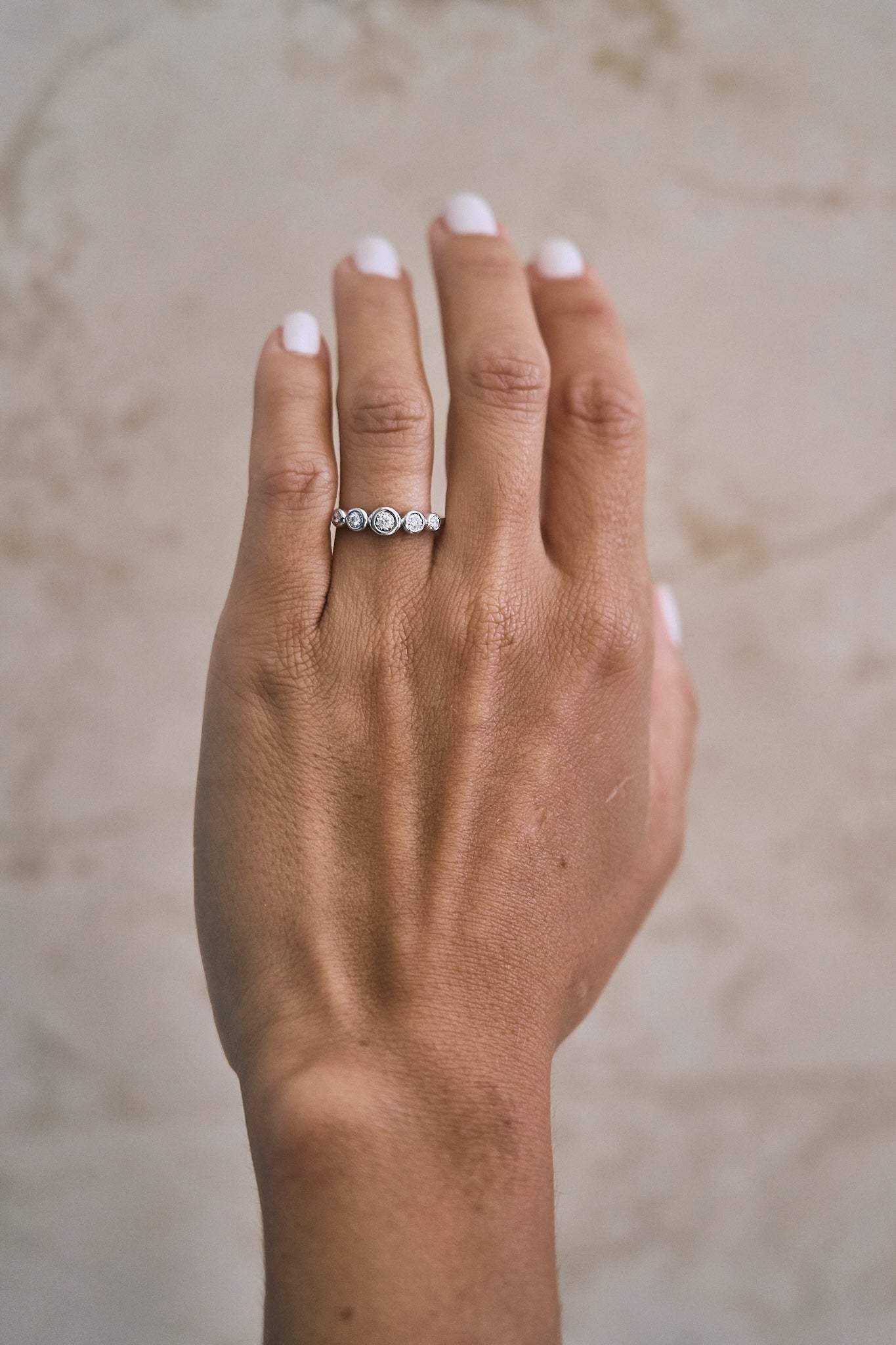 Graduated Bezel Diamond Ring