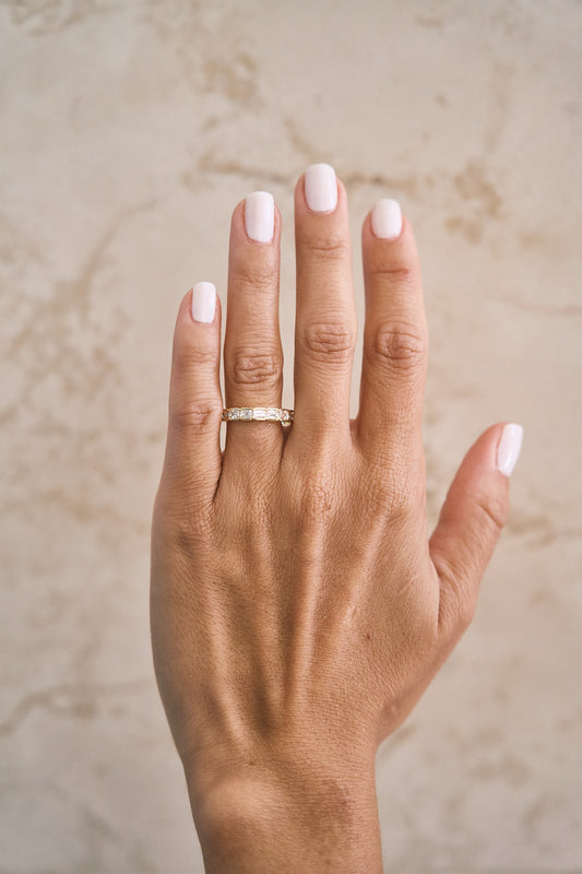 Half Bezel East West Emerald Cut Band