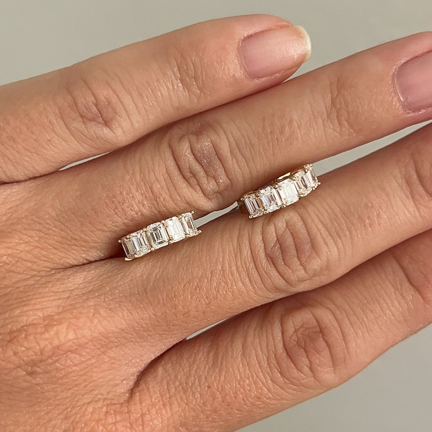 emerald cut diamond huggies 14K