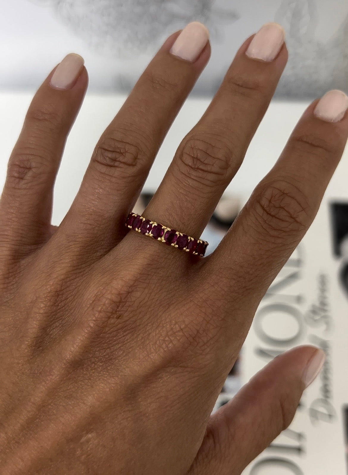 Oval Ruby Eternity Band – Henri Noël